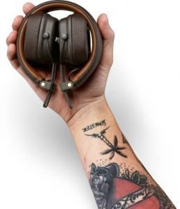 Wireless over-ear headphones held in hand, showcasing sleek design and comfort, ideal for music lovers during sales events.