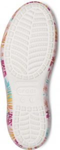 Vibrant floral patterned sole of colorful Crocs shoe, showcasing comfortable slip-on design and anti-slip tread for kids. Perfect for active wear and casual outings.