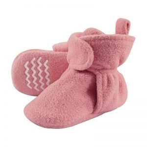 Soft pink fleece baby booties with cozy design and non-slip sole, perfect for keeping infant feet warm and comfortable during chilly days. Ideal for newborns and baby showers.