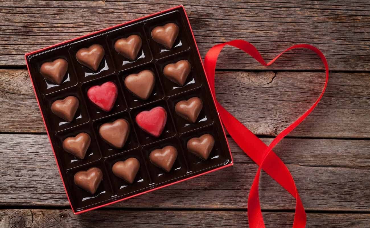 heart shape chocolate candy gift box on wodden table