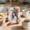 Elegant floral photo frame with a smiling young woman, perfect for Mother’s Day gifts for first-time grandmothers.
