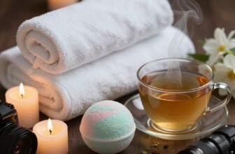 Cozy spa gift setup with towels, tea, candles, and bath bombs for a relaxing Mother's Day surprise. Perfect for pampering moms with soothing self-care gifts.